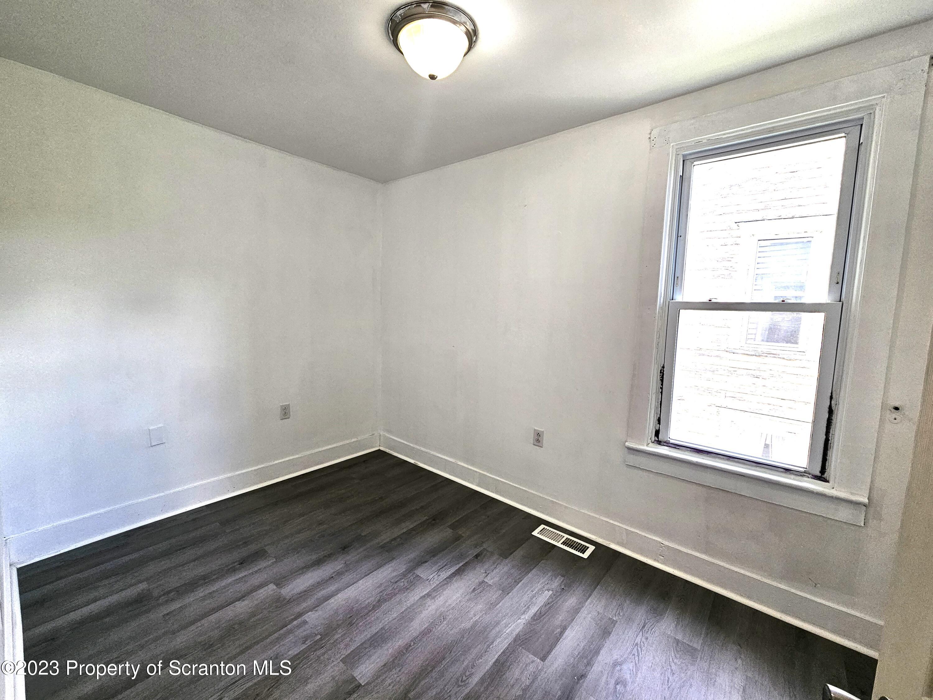 907 Green Ridge Street Scranton, PA 18509 - Photo 9 of 12 an empty room with a window