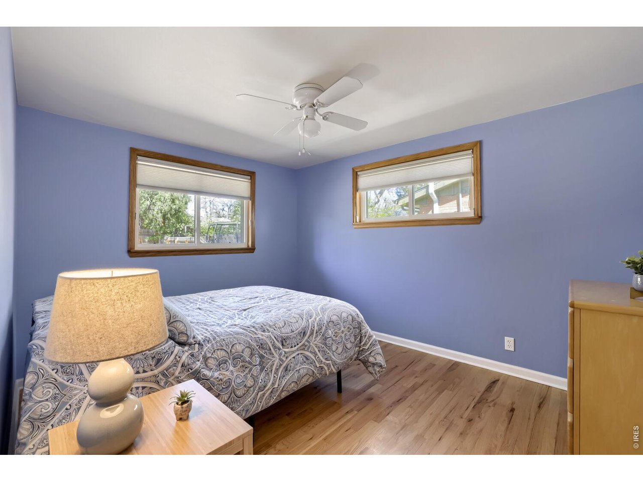 125 South 33rd Street Boulder, CO 80305 - Photo 11 of 17 a bedroom with a bed and a painting on the wall
