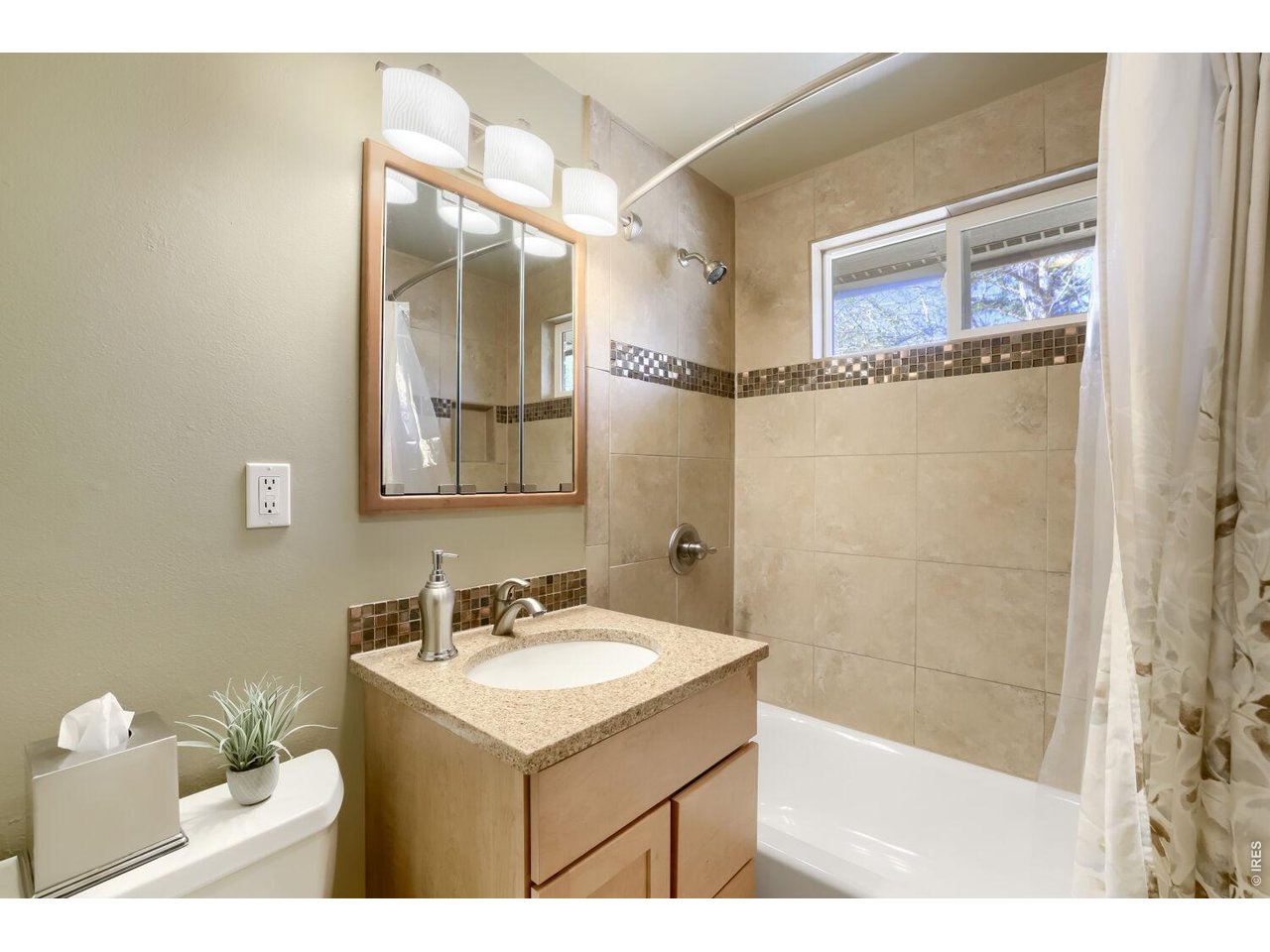 125 South 33rd Street Boulder, CO 80305 - Photo 12 of 17 a bathroom with a sink mirror and a shower