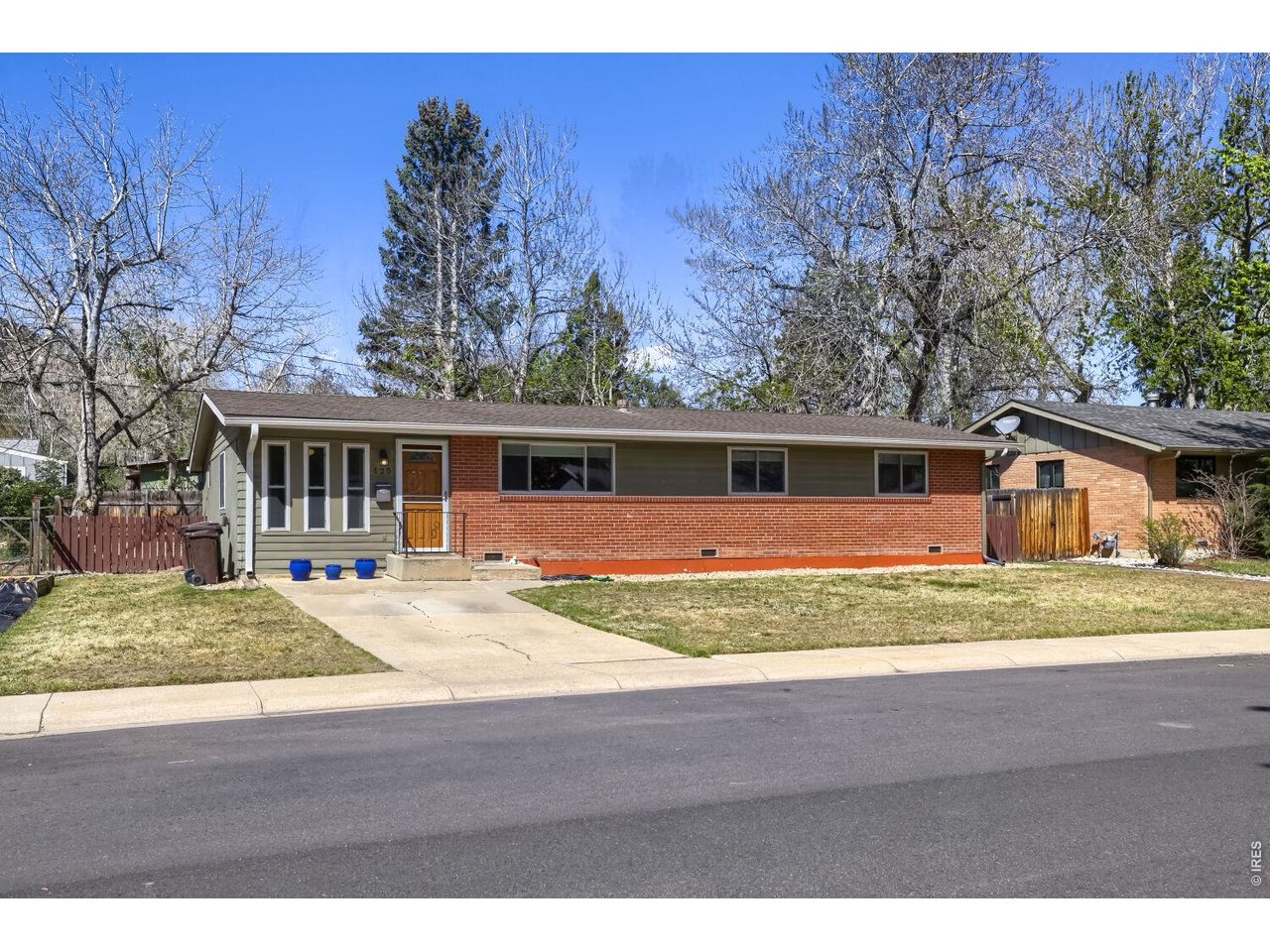 125 South 33rd Street Boulder, CO 80305 - Photo 3 of 17 a front view of house with yard seating and green space