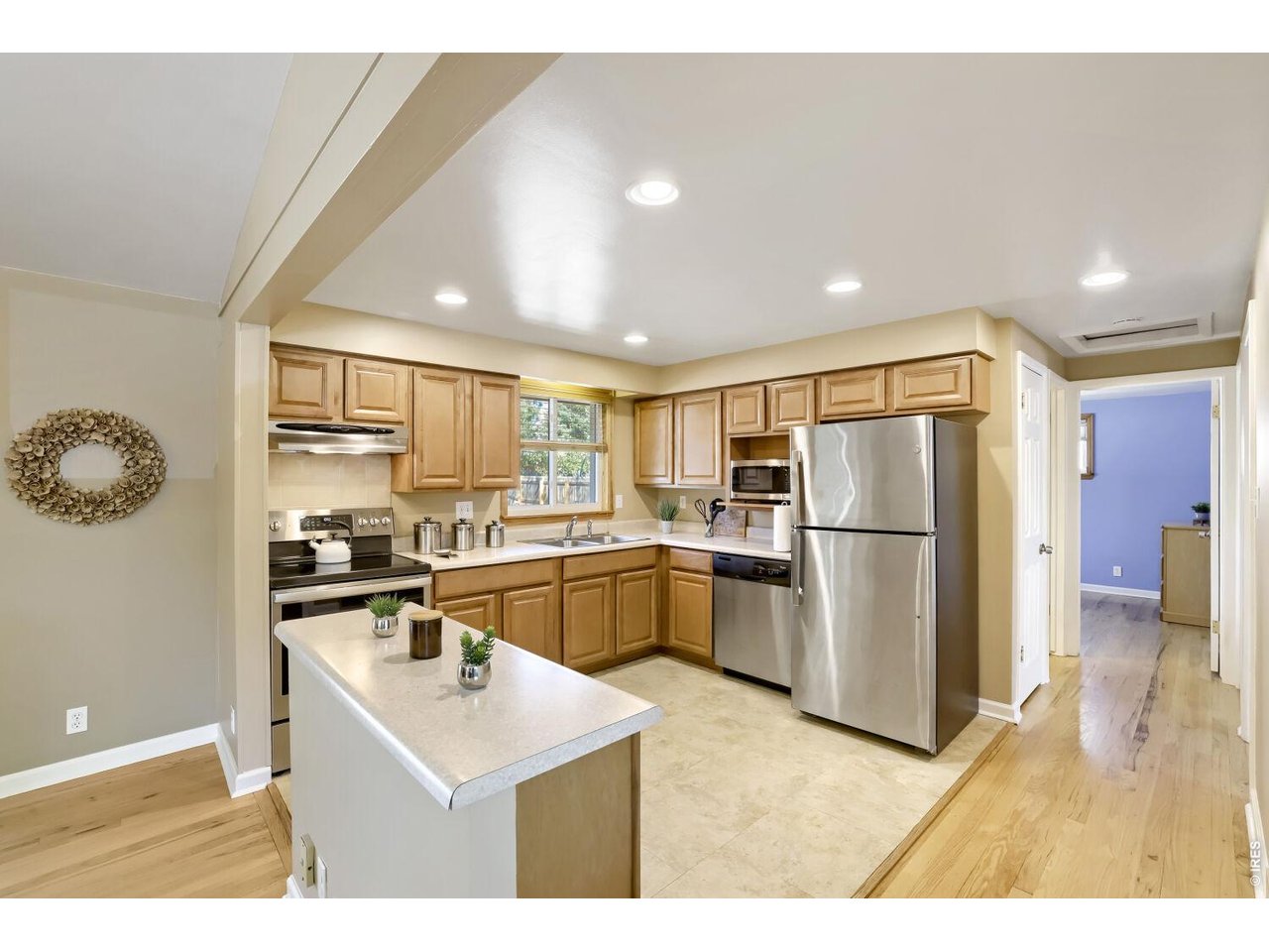 125 South 33rd Street Boulder, CO 80305 - Photo 17 of 17 a kitchen with a refrigerator a sink dishwasher and a stove with wooden floor