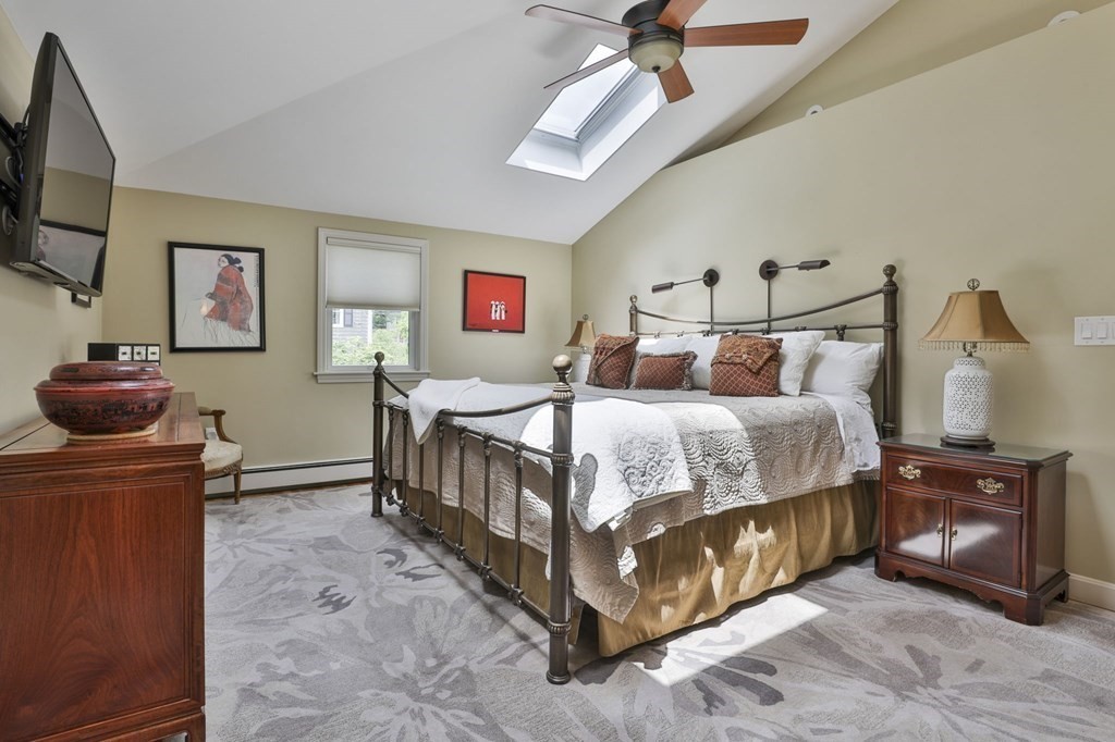 75 Valley Road Milton, MA 02186 - Photo 16 of 41 a bedroom with bed and a chandelier