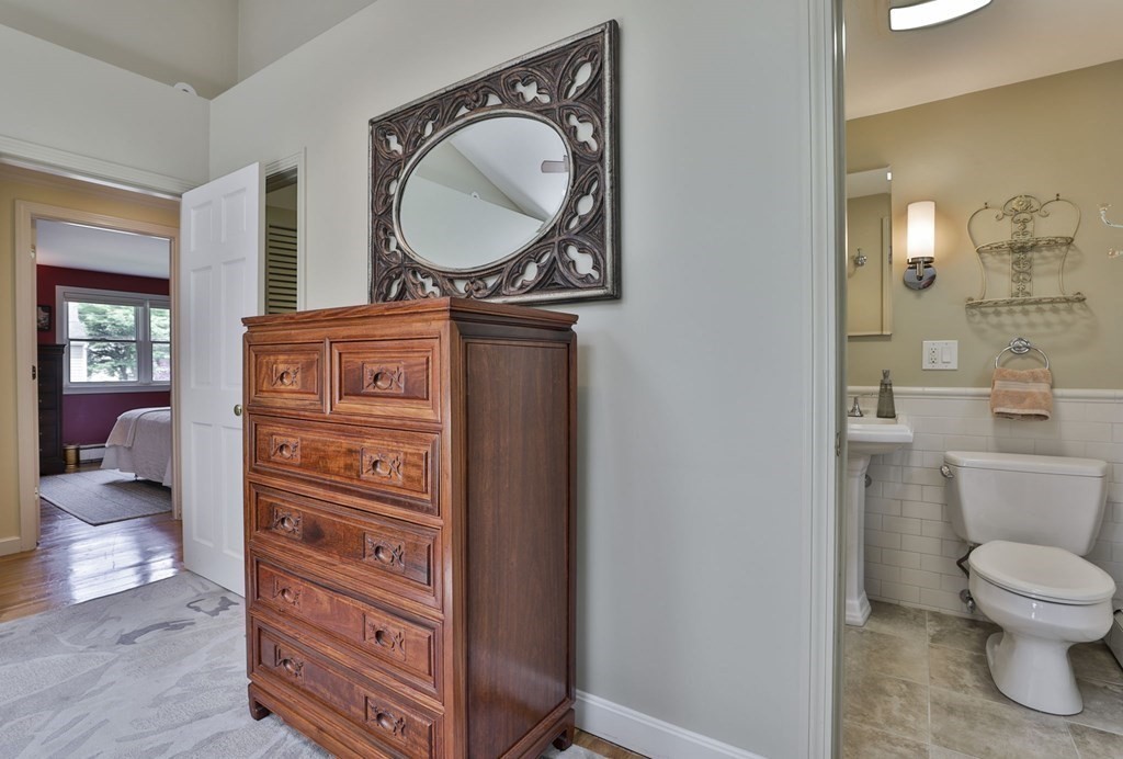 75 Valley Road Milton, MA 02186 - Photo 18 of 41 a view of bathroom with a toilet and a mirror