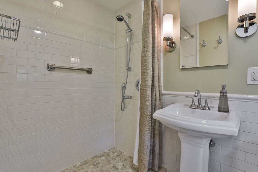 75 Valley Road Milton, MA 02186 - Photo 19 of 41 a bathroom with a sink and a mirror