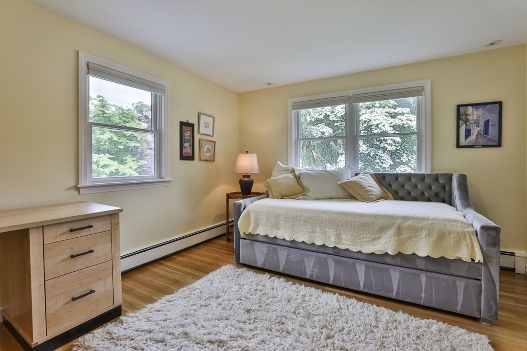 75 Valley Road Milton, MA 02186 - Photo 21 of 41 a bedroom with a bed and a dresser