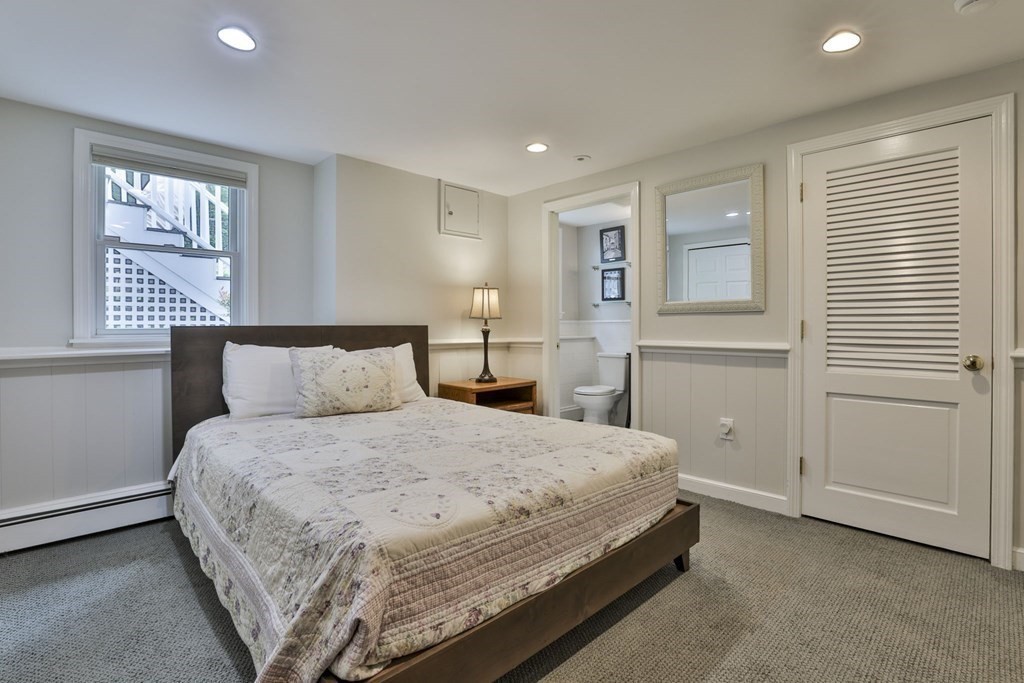 75 Valley Road Milton, MA 02186 - Photo 29 of 41 a bedroom with a bed and a window