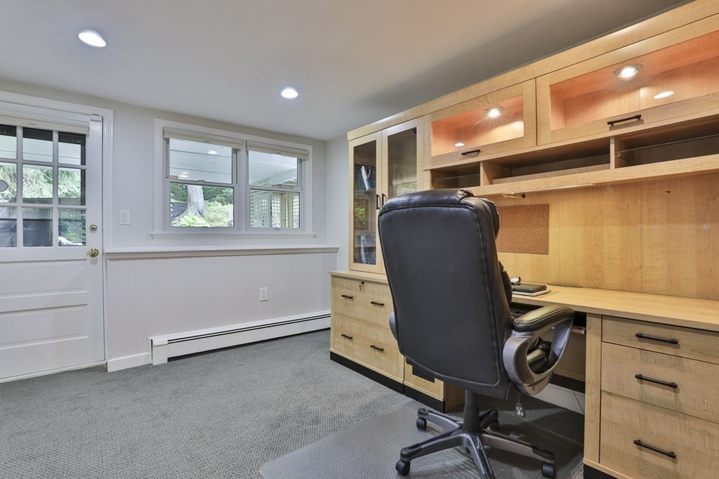 75 Valley Road Milton, MA 02186 - Photo 31 of 41 a view of a workspace with furniture and a window