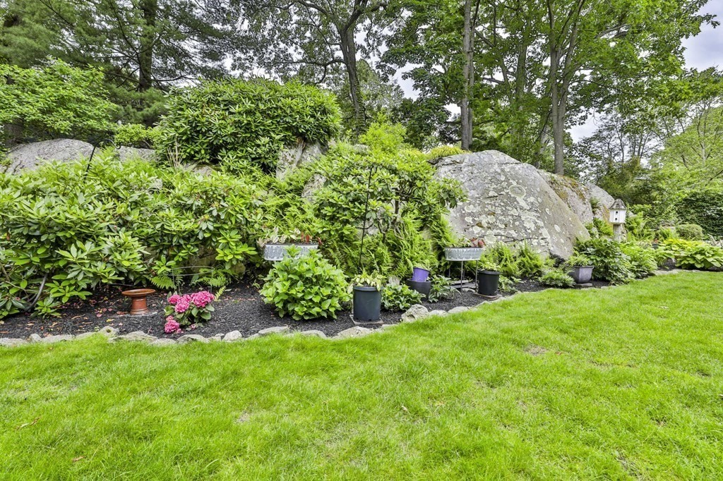 75 Valley Road Milton, MA 02186 - Photo 34 of 41 a yard with lots of green space and a fountain