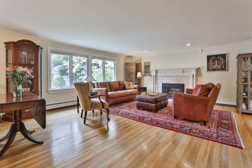 75 Valley Road Milton, MA 02186 - Photo 4 of 41 a living room with furniture and a wooden floor