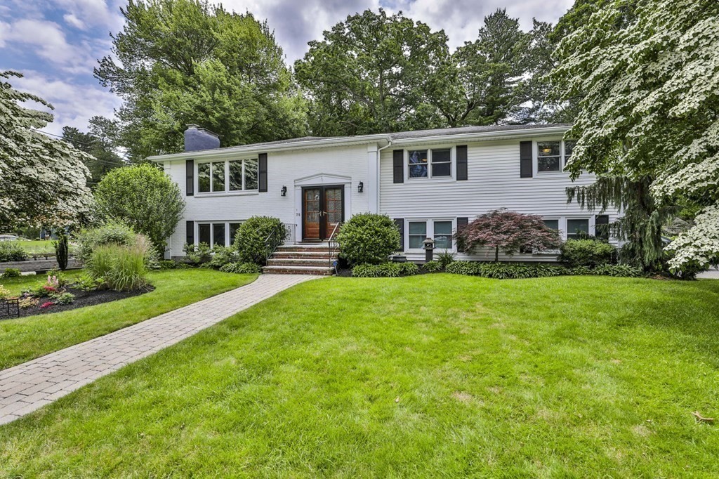 75 Valley Road Milton, MA 02186 - Photo 41 of 41 a front view of a house with a yard and green space