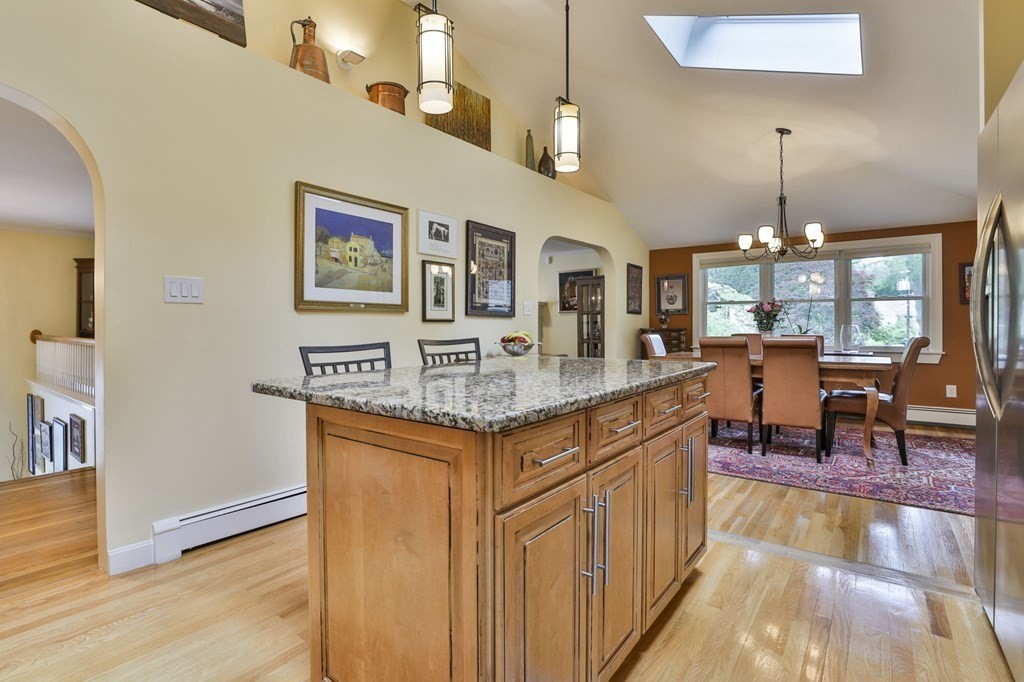 75 Valley Road Milton, MA 02186 - Photo 9 of 41 a kitchen with stainless steel appliances granite countertop a stove and cabinets