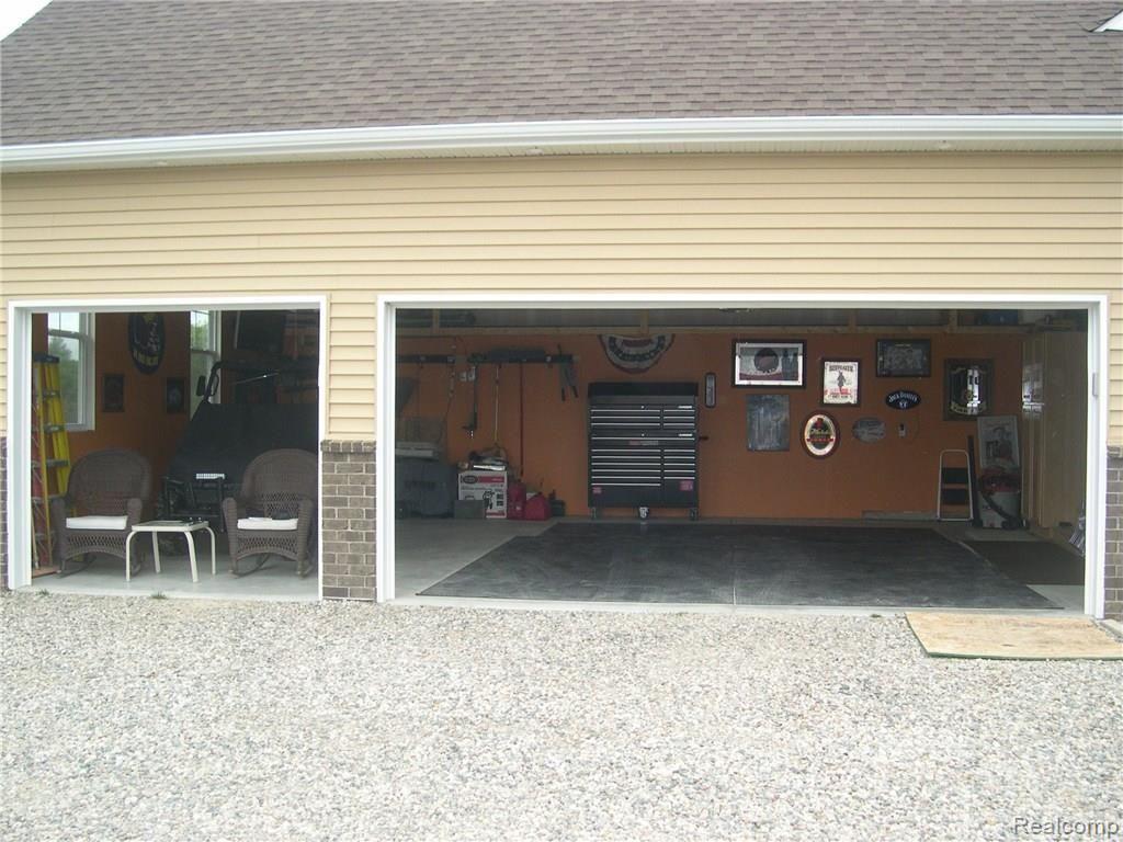 4170 Elevation Lane Howell, MI 48855 - Photo 5 of 36 INSIDE 3 CAR GARAGE, CEILINGS AND WALLS ARE INSULATED