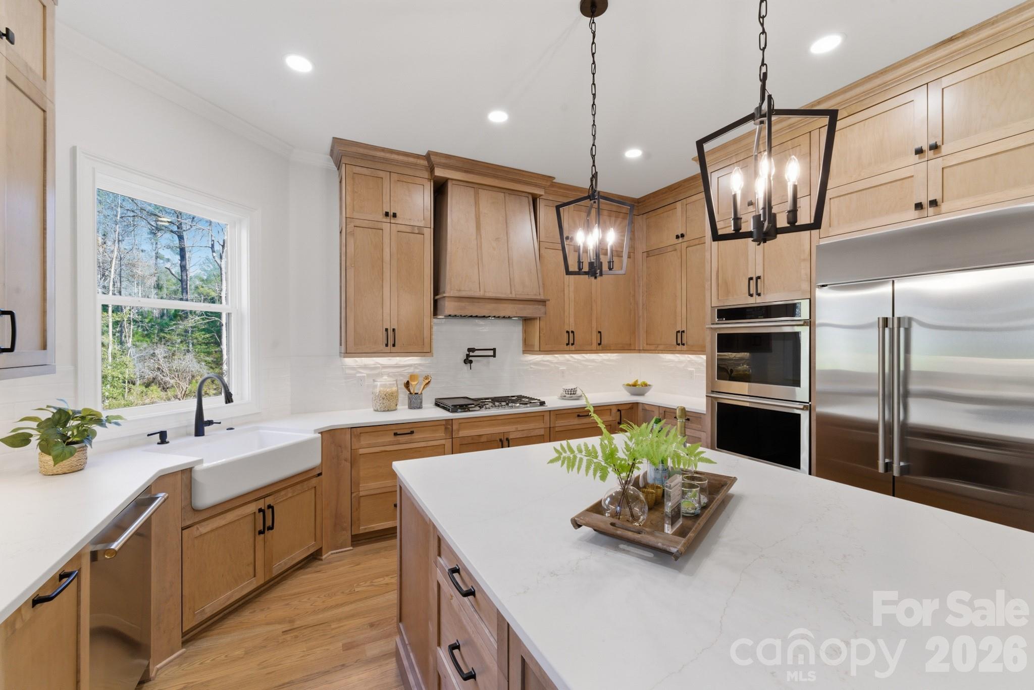 6405 Chimney Bluff Road Lancaster, SC 29720 - Photo 16 of 38 a kitchen with stainless steel appliances granite countertop a sink a stove and a refrigerator