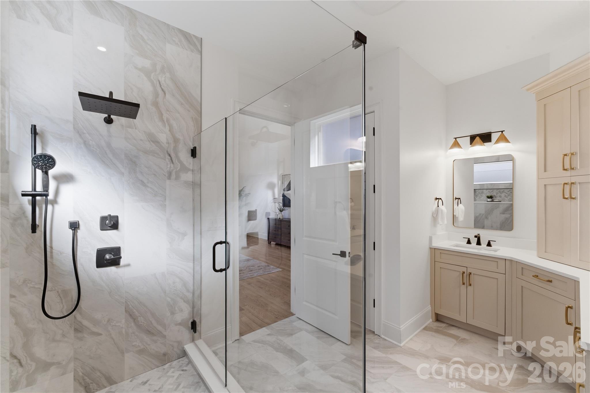 6405 Chimney Bluff Road Lancaster, SC 29720 - Photo 26 of 38 a bathroom with a shower sink and mirror