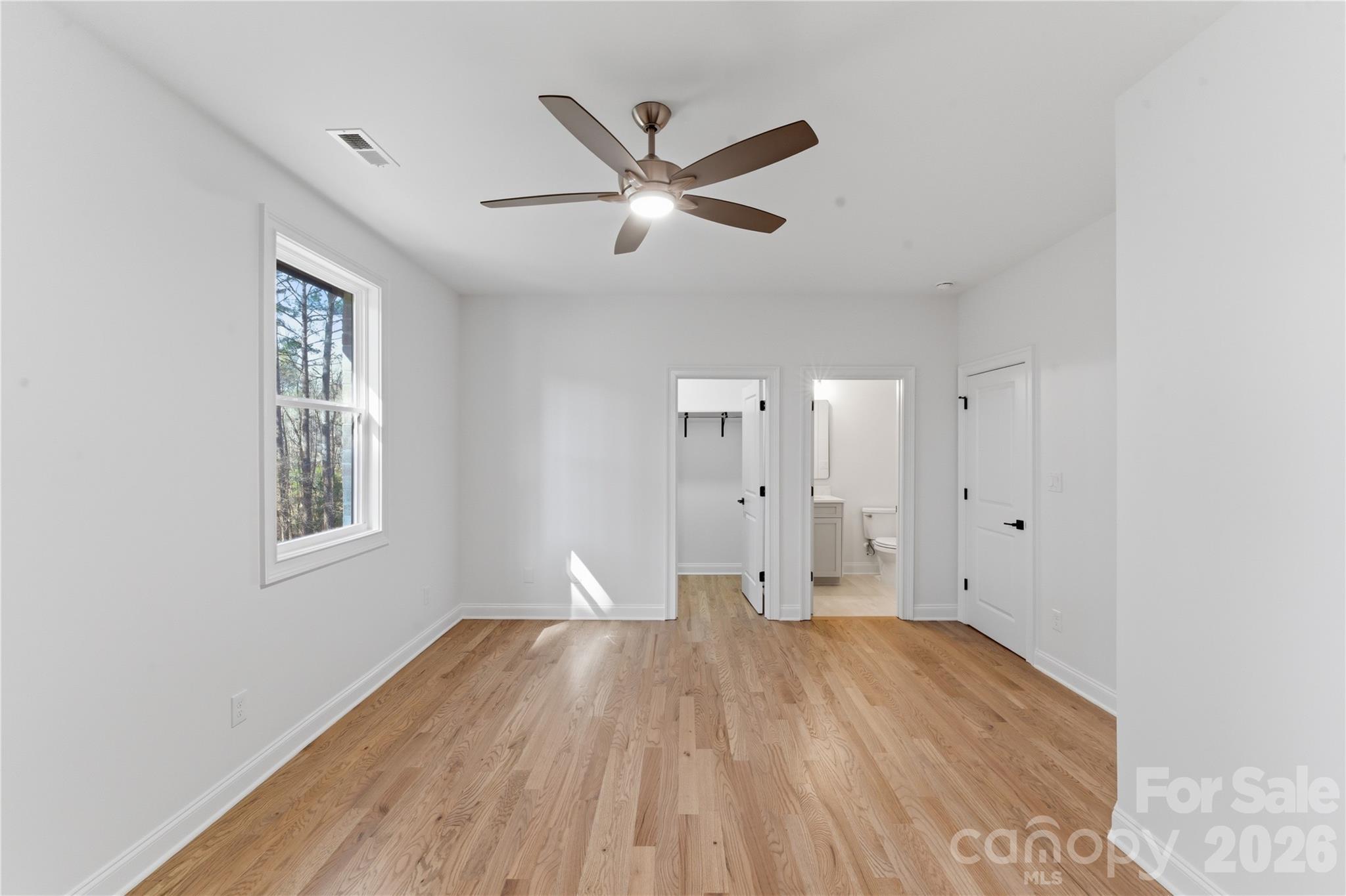 6405 Chimney Bluff Road Lancaster, SC 29720 - Photo 30 of 38 a view of empty room with wooden floor and fan