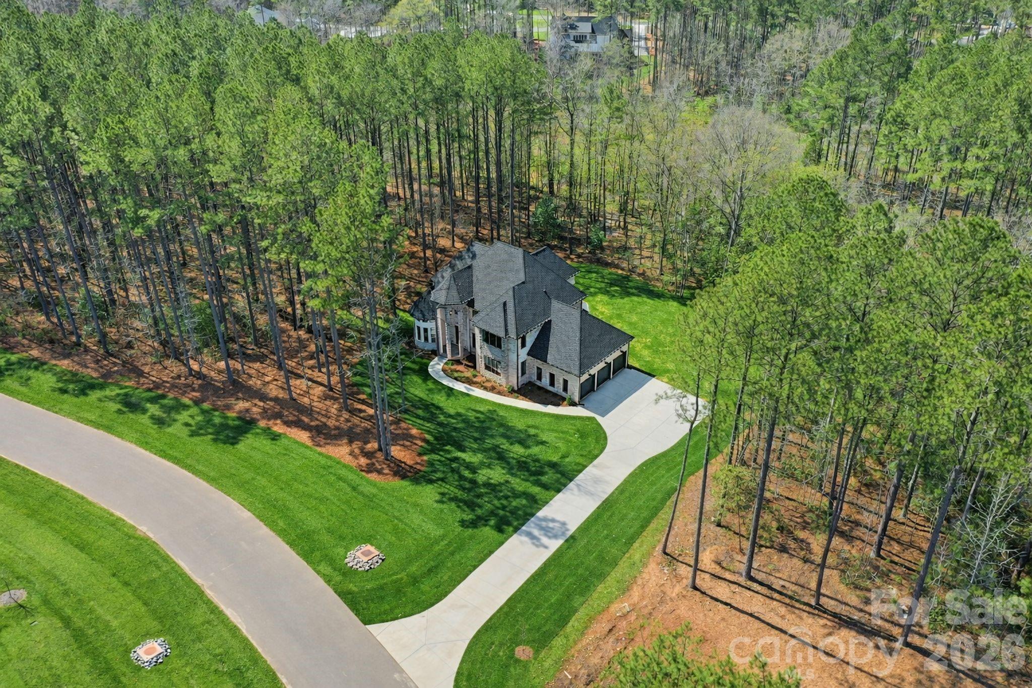 6405 Chimney Bluff Road Lancaster, SC 29720 - Photo 3 of 38 a view of a garden with a house