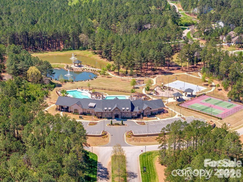 6405 Chimney Bluff Road Lancaster, SC 29720 - Photo 38 of 38 an aerial view of residential houses with outdoor space and swimming pool