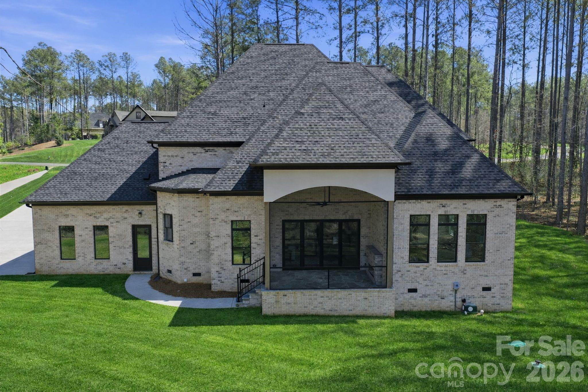 6405 Chimney Bluff Road Lancaster, SC 29720 - Photo 6 of 38 a front view of a house with a garden and yard