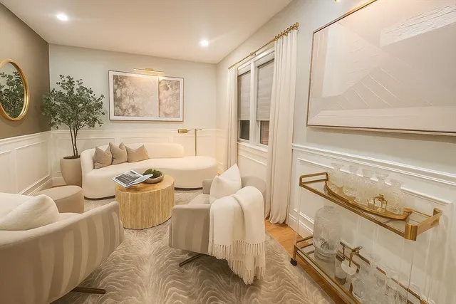 a workspace with furniture and a wooden floor