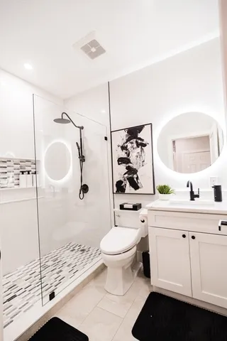 a bedroom with bed and window