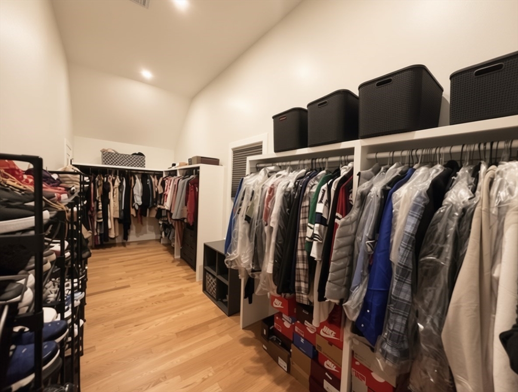 6 Rivendell Lane Millis, MA 02054 - Photo 38 of 41 a view of walk in closet with clothes and shoes