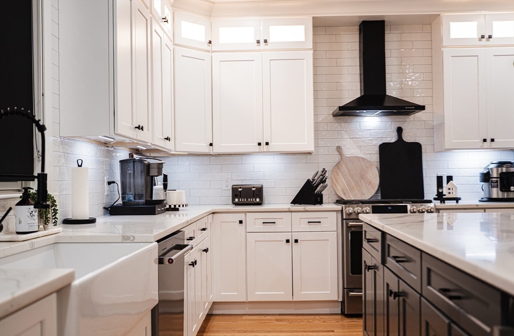 6 Rivendell Lane Millis, MA 02054 - Photo 6 of 41 a kitchen with stainless steel appliances granite countertop a sink a stove and a microwave