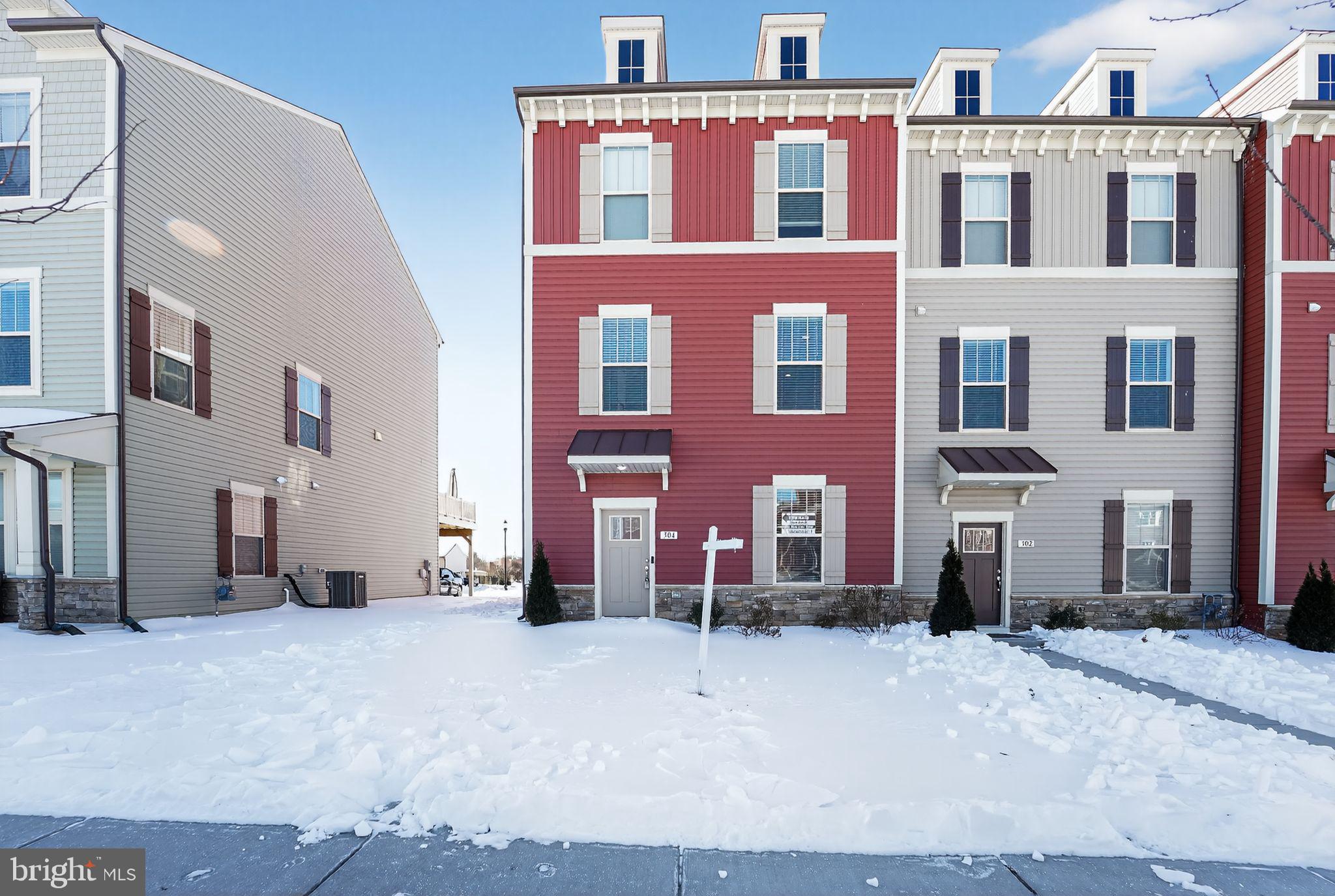 304 Faversham Place Frederick, MD 21701 - Photo 1 of 32 a view of a building with a yard