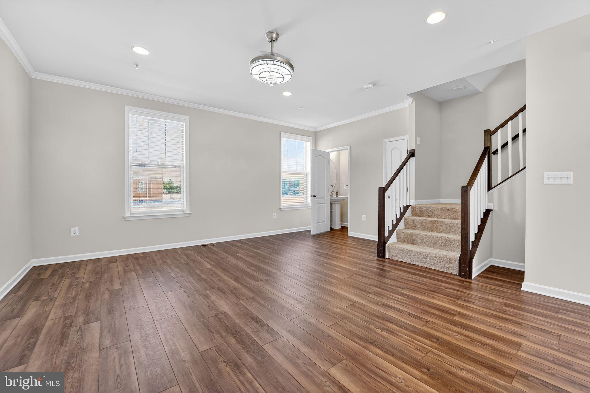 304 Faversham Place Frederick, MD 21701 - Photo 20 of 32 a view of entryway with wooden floor and stairs
