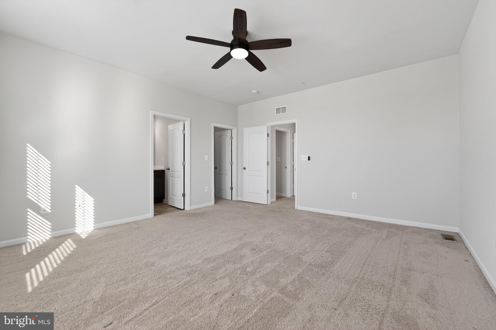 304 Faversham Place Frederick, MD 21701 - Photo 23 of 32 a view of a livingroom with a ceiling fan window and hardwood floor