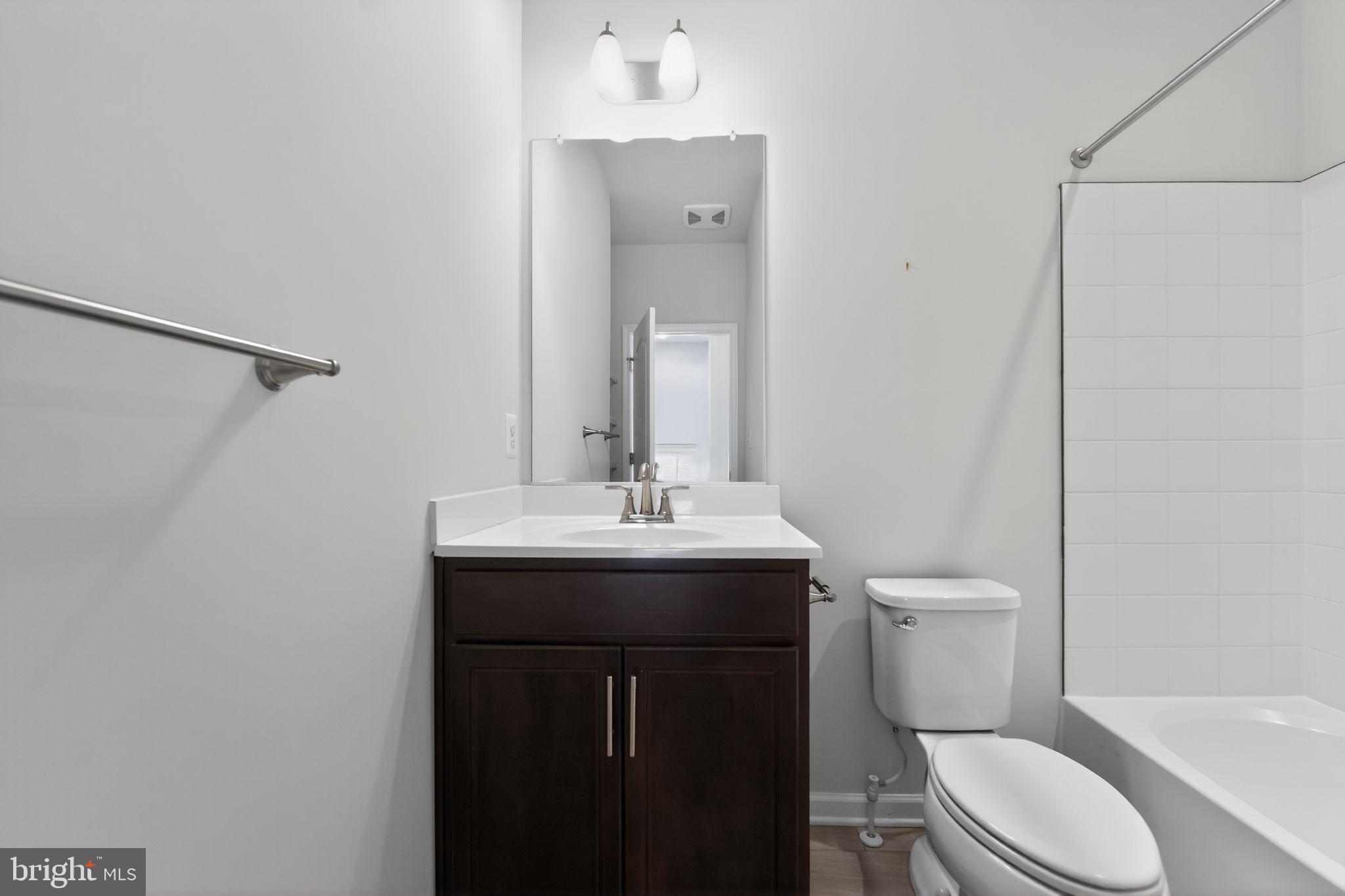 304 Faversham Place Frederick, MD 21701 - Photo 31 of 32 a bathroom with a sink toilet and shower