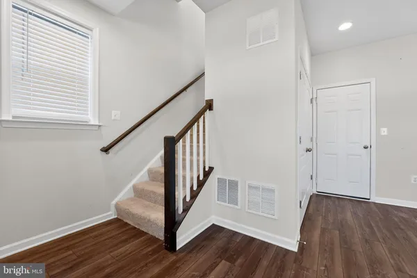 a view of entryway with wooden floor