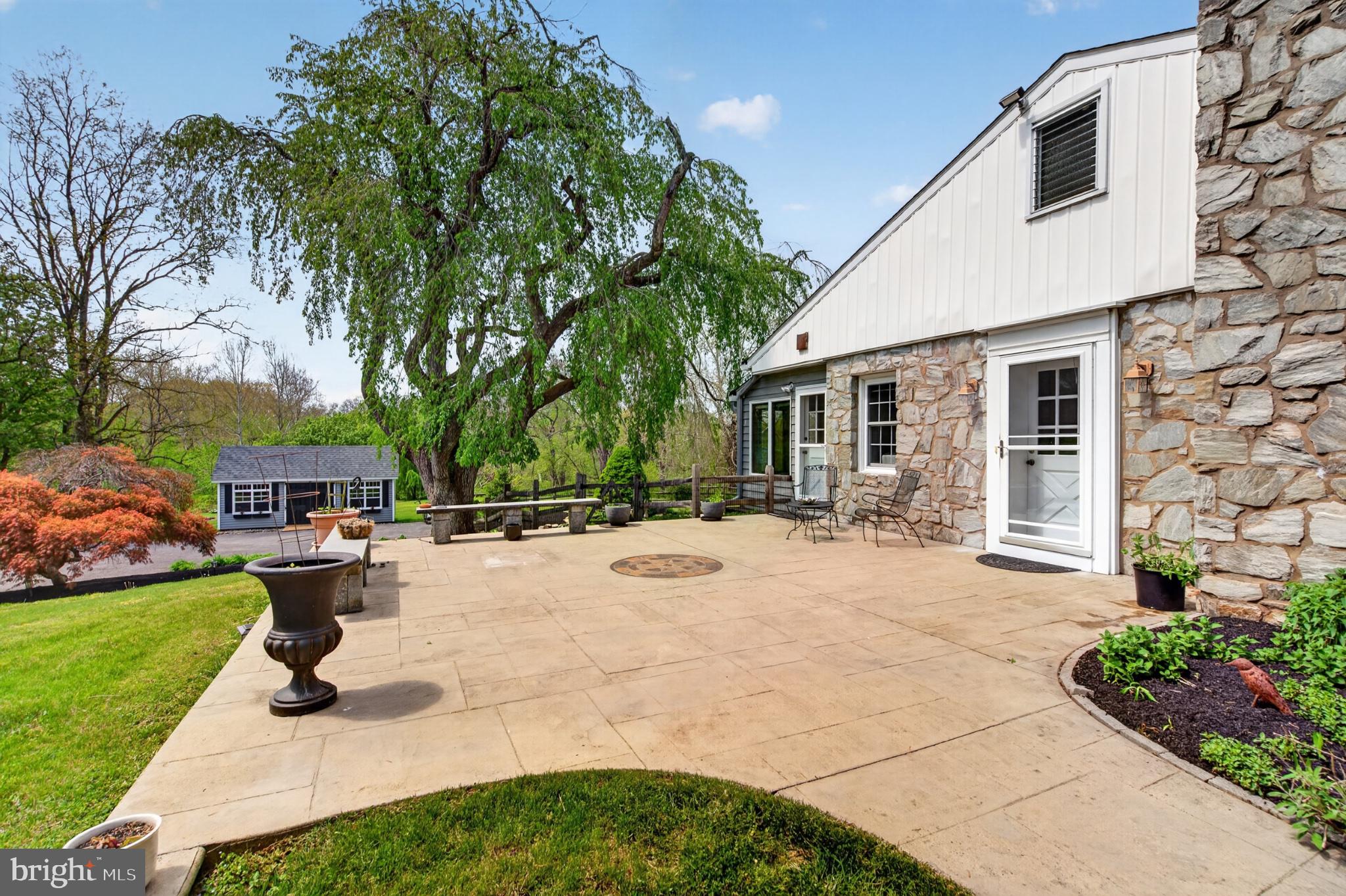 300 Sanatoga Road Pottstown, PA 19465 - Photo 51 of 79 Serene patio with lush greenery.