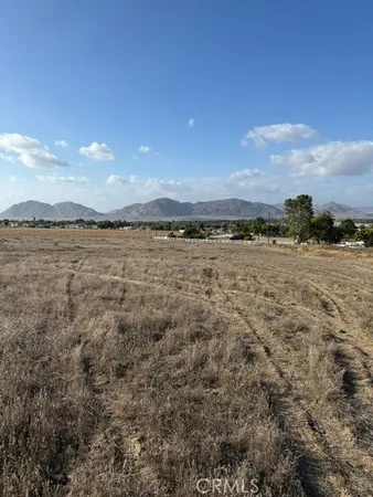 a view of an ocean beach and mountain