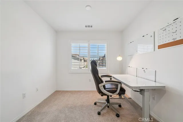 a view of a workspace with furniture