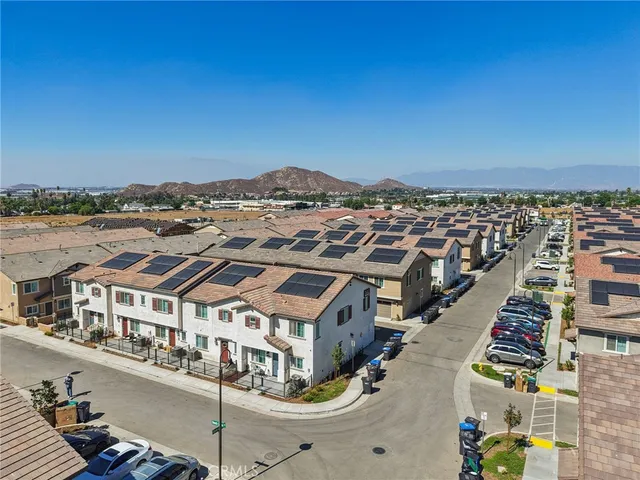 a view of a city that has tall buildings and a ocean view