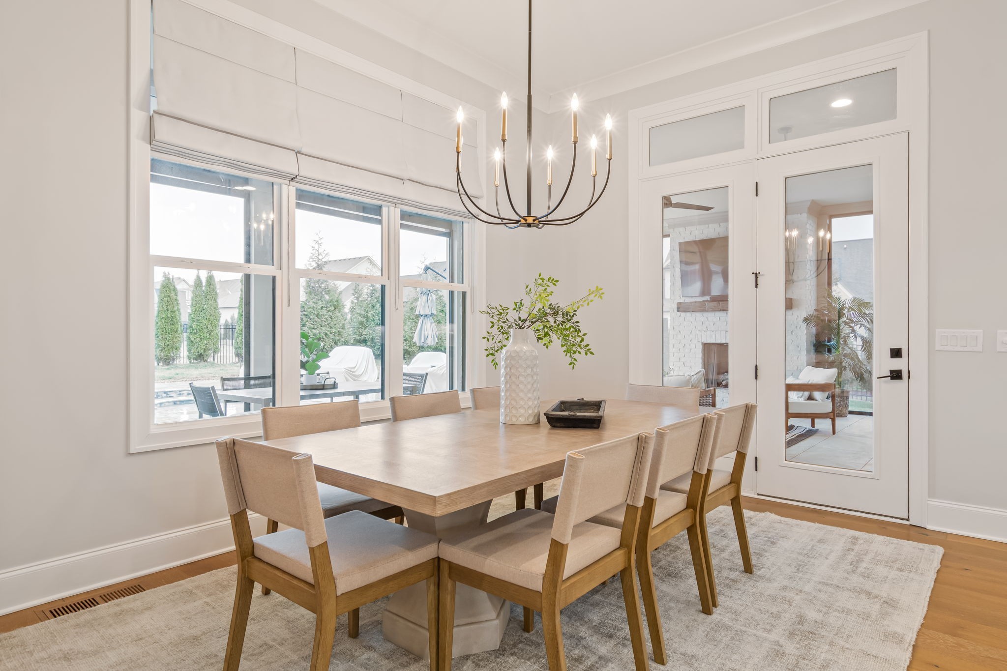 6304 Percheron Lane Arrington, TN 37014 - Photo 12 of 57 a dining room with furniture a chandelier and wooden floor