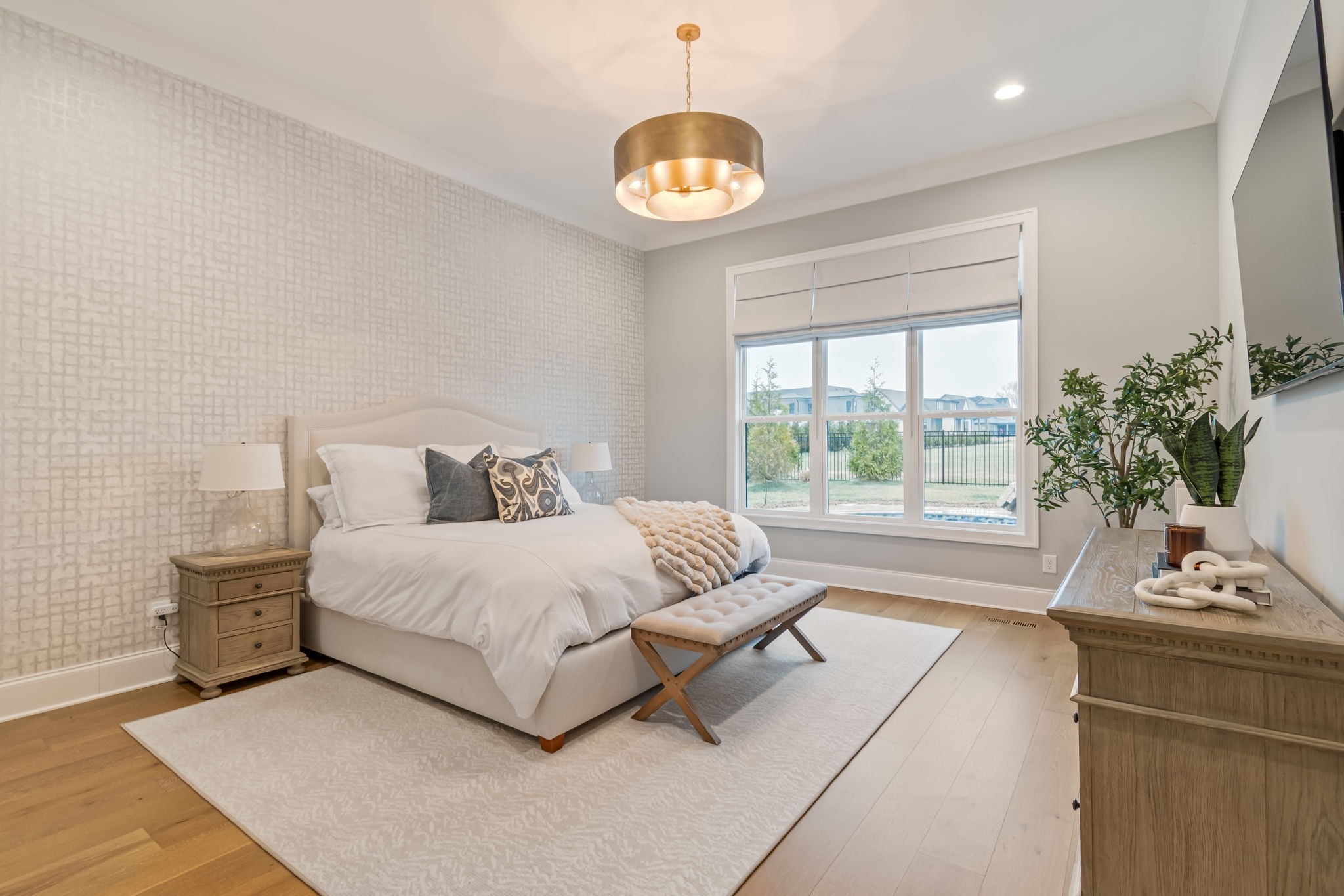 6304 Percheron Lane Arrington, TN 37014 - Photo 19 of 57 a spacious bedroom with a bed and a large window