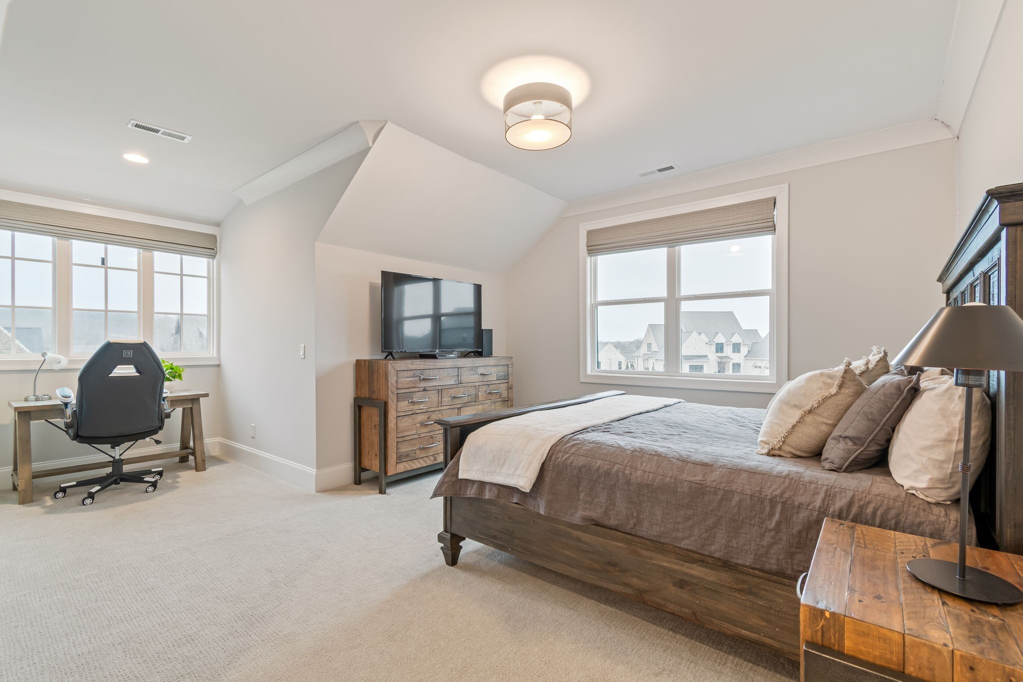 6304 Percheron Lane Arrington, TN 37014 - Photo 35 of 57 a bedroom with a bed large window and chair