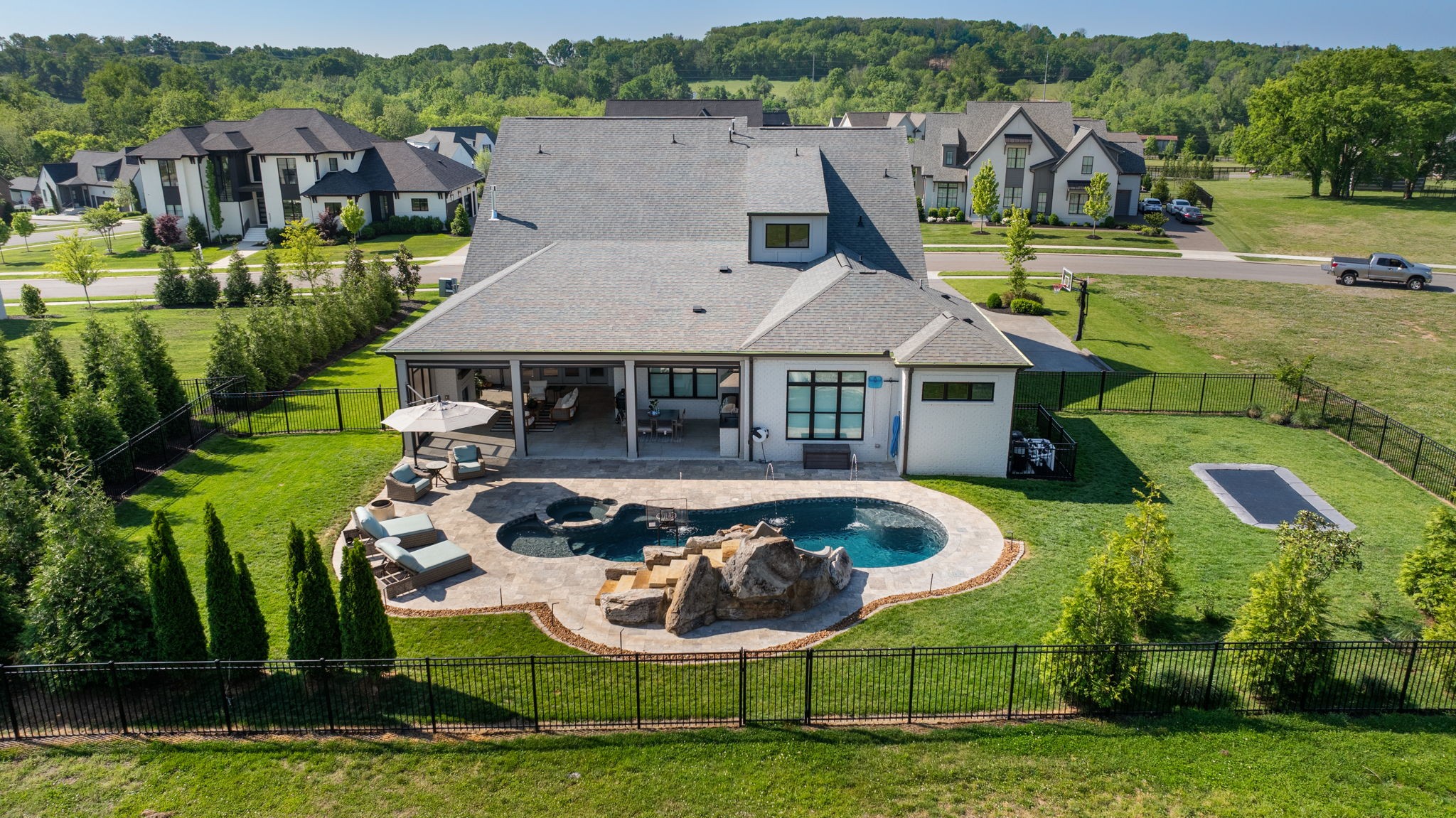 6304 Percheron Lane Arrington, TN 37014 - Photo 55 of 57 an aerial view of a house with swimming pool lawn chairs and large trees