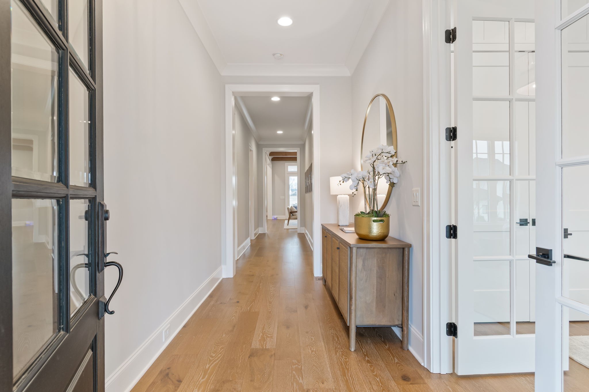 6304 Percheron Lane Arrington, TN 37014 - Photo 8 of 57 a view of a hallway with wooden floor and furniture