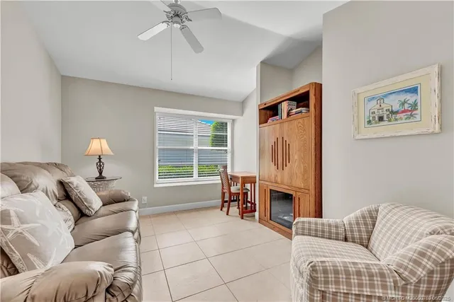 a living room with furniture a window and a fireplace