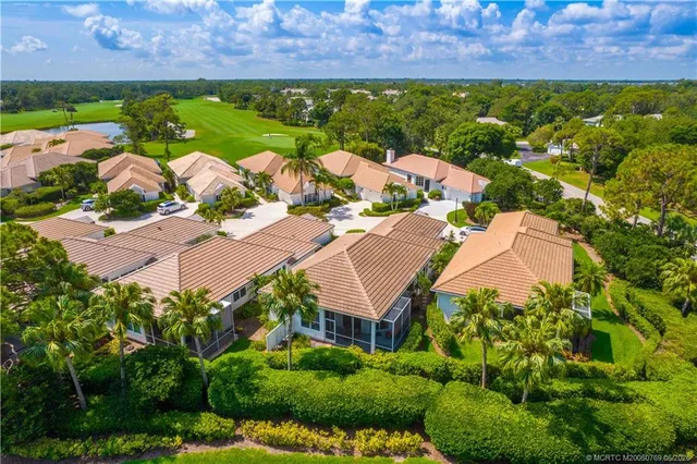 an aerial view of residential house with outdoor space and street view