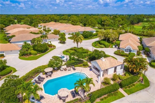 an aerial view of a house with a garden