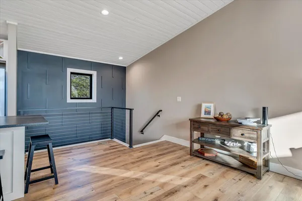 a living room with furniture and kitchen view