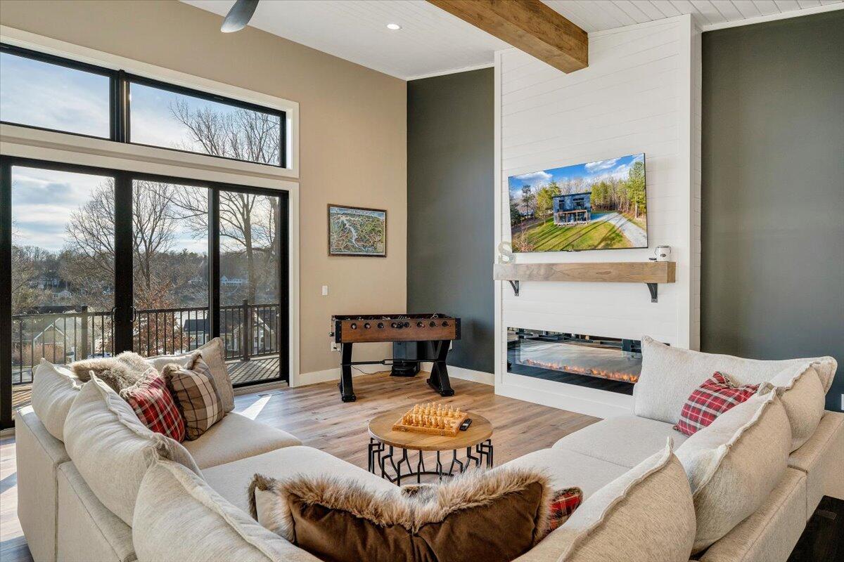 5 Reserve Road Moneta, VA 24121 - Photo 28 of 95 a living room with furniture and a floor to ceiling window