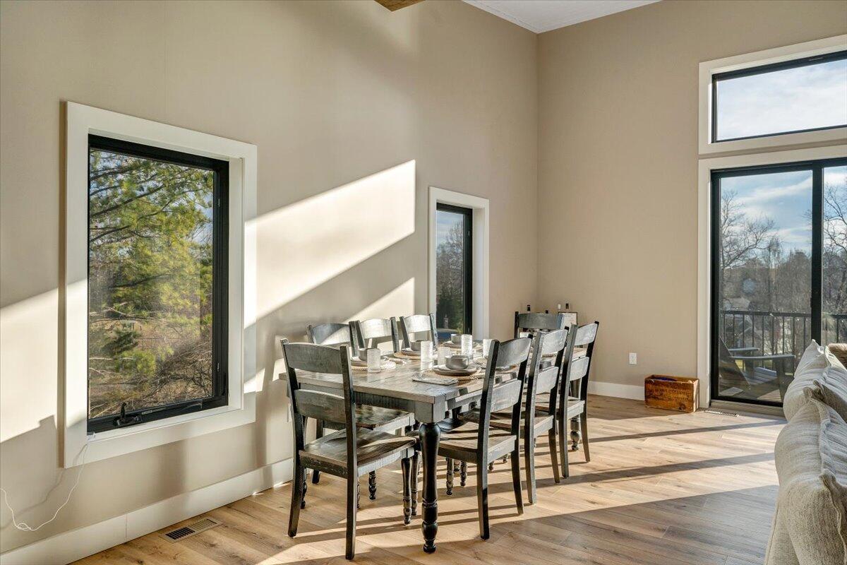 5 Reserve Road Moneta, VA 24121 - Photo 32 of 95 a view of a dining room with furniture window and wooden floor