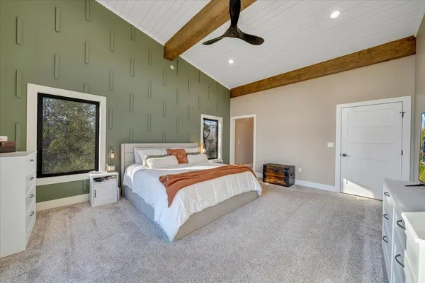 a bedroom with a bed and a desk