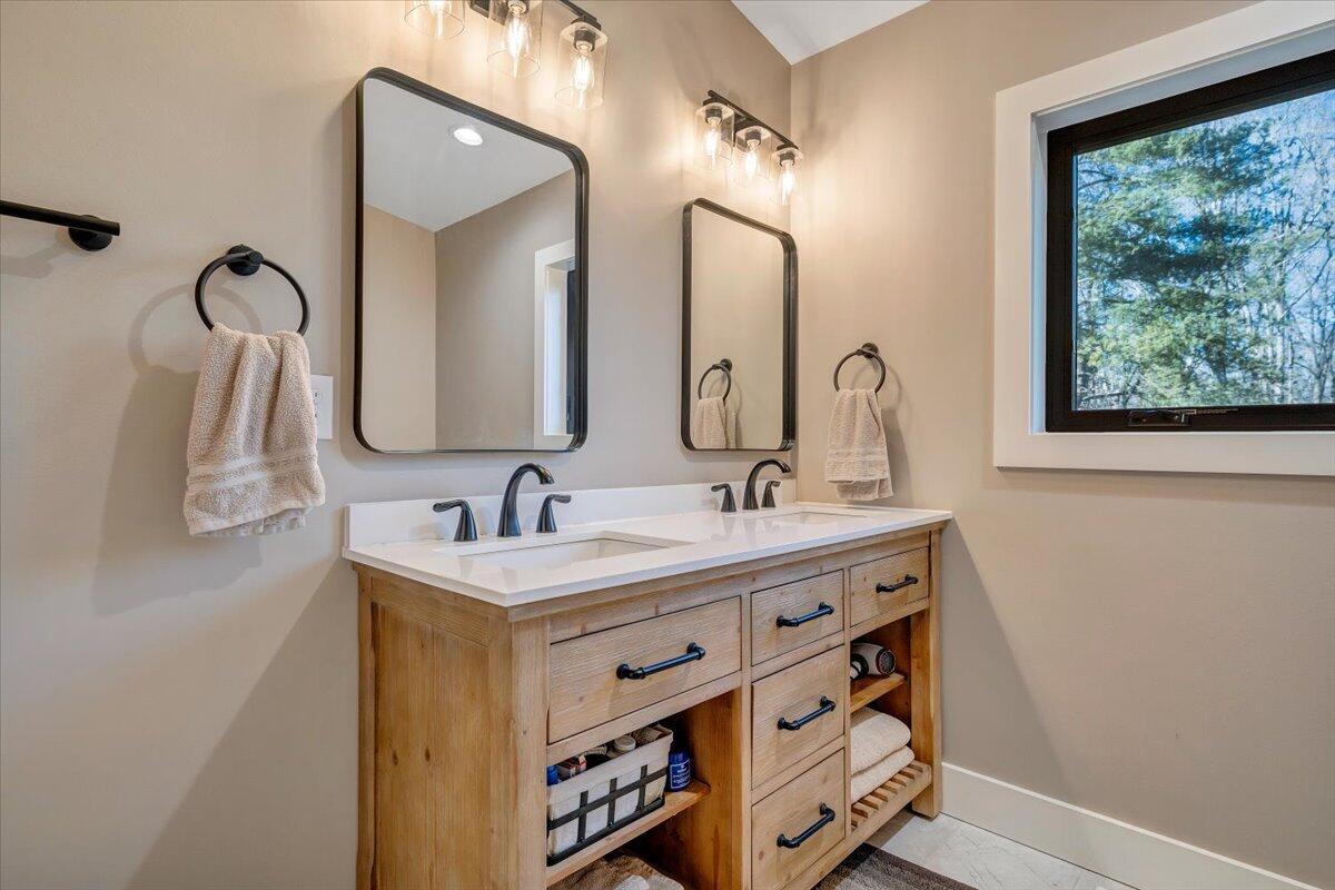 5 Reserve Road Moneta, VA 24121 - Photo 43 of 95 a bathroom with a double vanity sink and a mirror