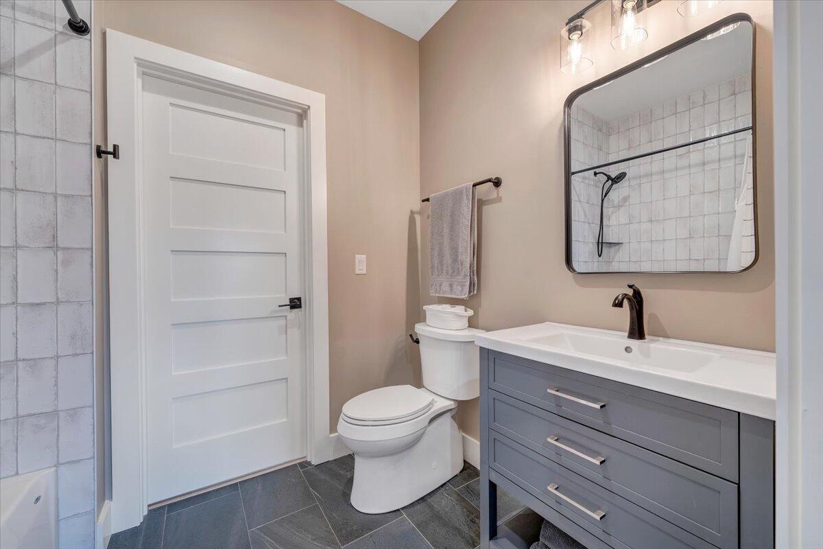 5 Reserve Road Moneta, VA 24121 - Photo 52 of 95 a bathroom with a sink a toilet and shower