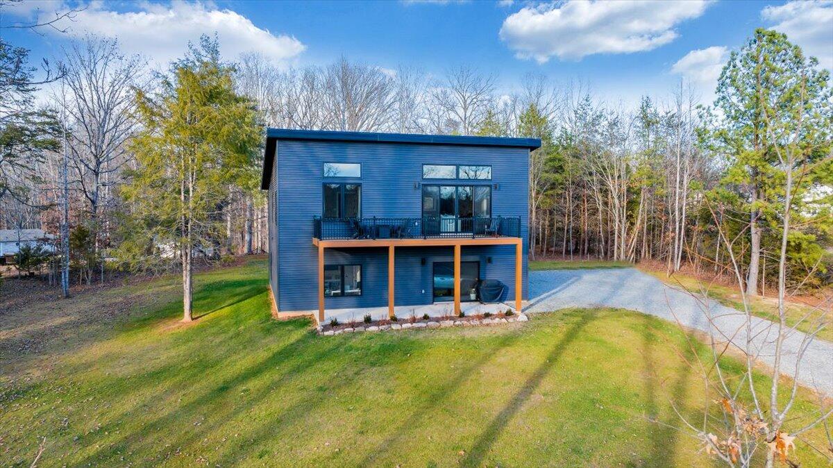 5 Reserve Road Moneta, VA 24121 - Photo 9 of 95 a view of a house with swimming pool and sitting area